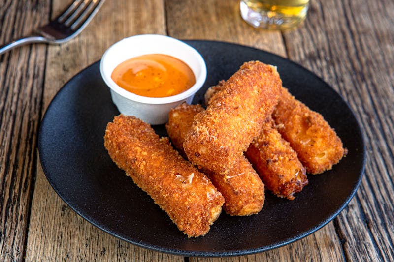 Mozzarella sticks with spicy tomato dipping sauce