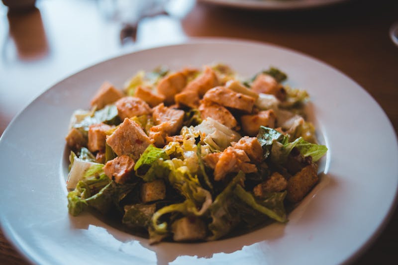 Grilled chicken salad with avocado and greens