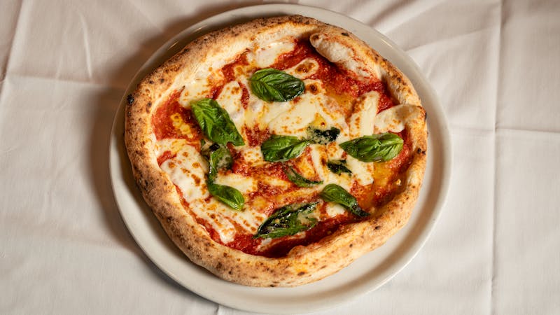 Punch Classic Margherita punch pizza with fresh basil and mozzarella